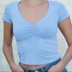 brandy melville blue and white flower gina shirt